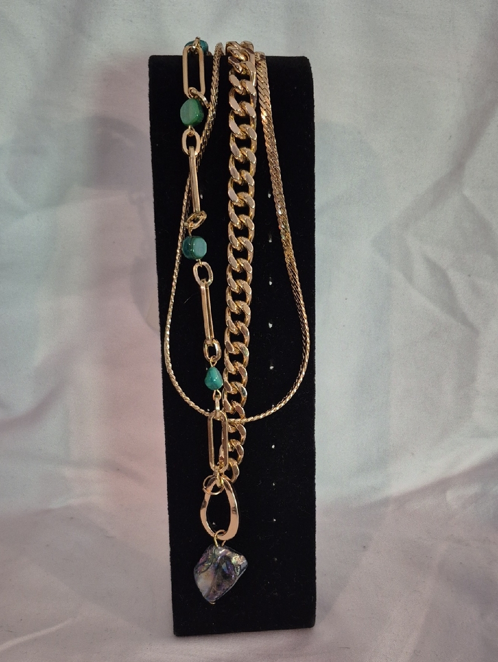 Gold-Tone Multi-Strand Necklace with Green Beads and Iridescent Pendant